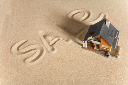 House on sand. Real estate conceptの写真素材