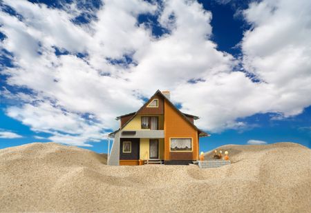 House on sand. Real estate conceptの写真素材