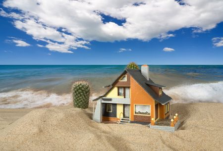 House on sand. Real estate conceptの写真素材