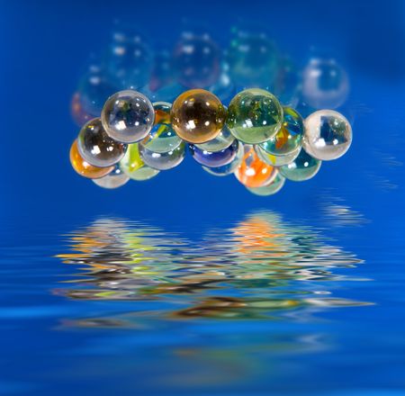Color glass balls on blue background