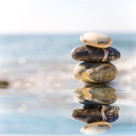 Stack of pebbles on sea backgroundの写真素材