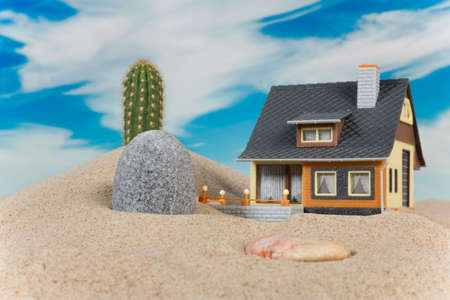 House on sand. Real estate conceptの写真素材