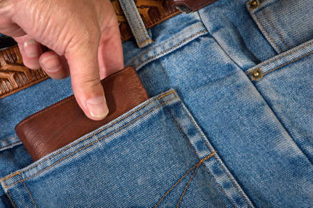 hand of the thief in pocket jeansの写真素材