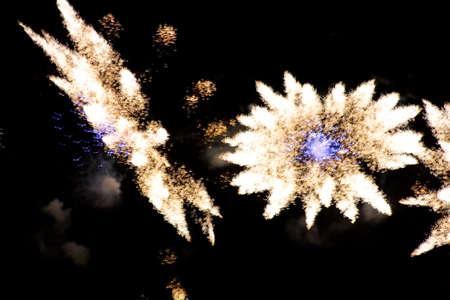 long exposure of multiple fireworks against a black sky