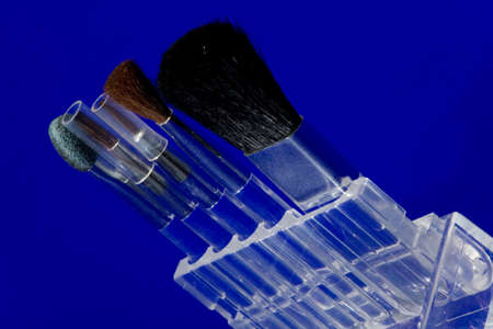  Make-up brushes on blue background