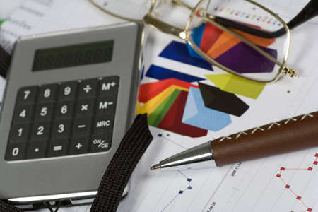 Financial concept. Calculator and pen.