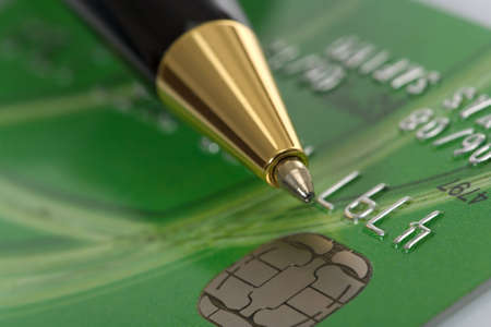 Close up a credit card and penの写真素材