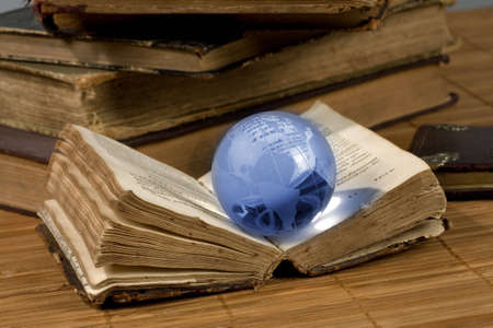 glass globe and the old bookの写真素材
