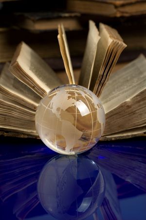 glass globe and the old bookの写真素材