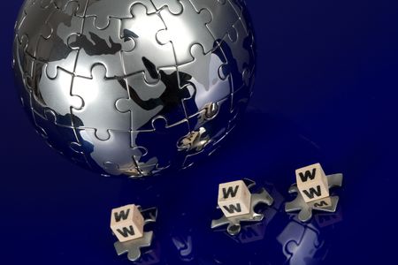 Globe puzzle on blue backgroundの写真素材