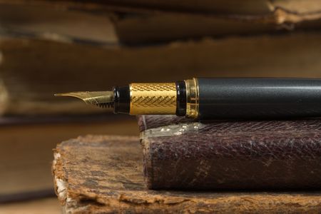 Old poetry book and a fountain penの写真素材