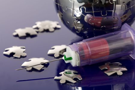 Globe puzzle on blue background. Medical concept.