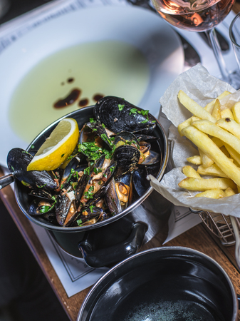 casserole of mussels on the tableの写真素材