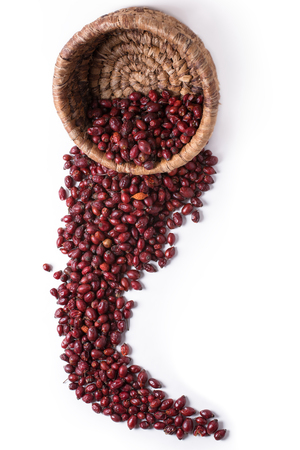 Dried rose hips in a wicker basket on a white background, in extended formの写真素材