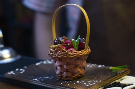 small basket with cherries, ornaments for cocktailsの写真素材