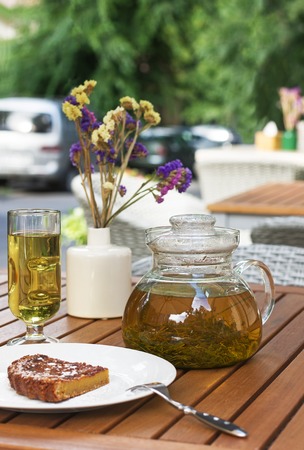 Tea served with cake on the terraceの写真素材