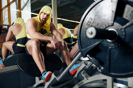 Portrait Of A Physically Fit Young Man Resting In A Health Modern Clubの写真素材