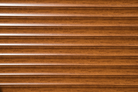 Close up of aluminium metal roller shutter door, Brown color. background