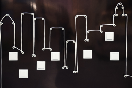 Abstract modern city life. Electric wire and light switches in the form of an abstraction of the...