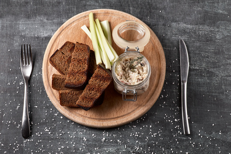 Forshmak paste from mackerel, toasts from fried bread, on wooden table. top view. selective focus. Concept of healthy food.の写真素材