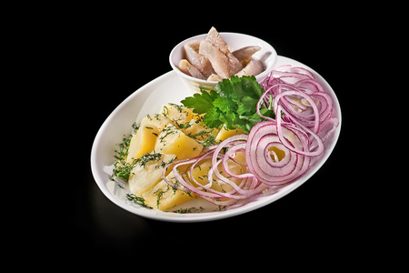 Russian traditional cuisine. Shub salad with herring. On a black wooden background. Copy space.の写真素材