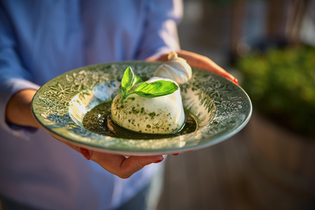 Burrata, fresh Italian cheese made from mozzarella and cream.