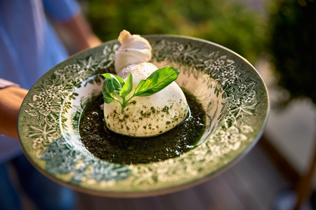 Burrata, fresh Italian cheese made from mozzarella and cream.