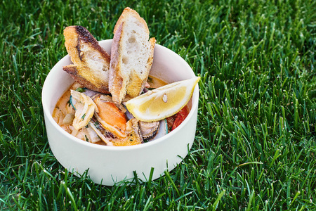 Mussels in wine with parsley and lemon. Seafood. Clams in the shells. Delicious snack for gourmands....