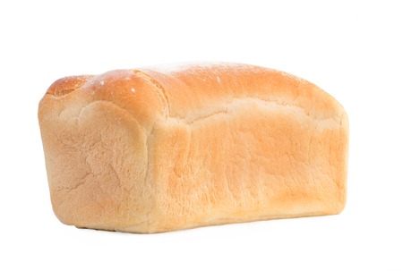 loaf of white bread on a white background, close up