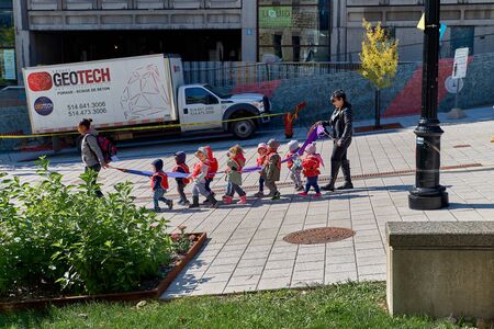 Montreal, Quebec, Canada, September 14, 2018: McGill Campus - State Research University in English. Teachers with young children from kindergarten stroll around the university yard. Living a happy lifestyle while traveling in Canada.のeditorial素材