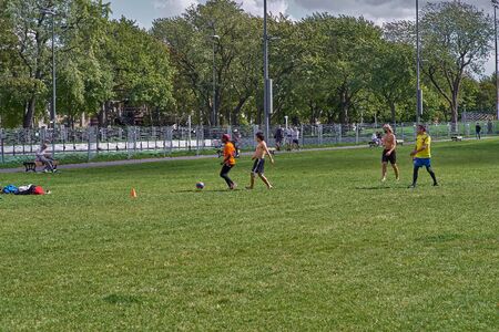 Montreal, Quebec, Canada September 29, 2018:People play football on the lawn in the Parc du Mont Royal on the basis of the Mont Royal in Montreal Canada. Travel to Canada as an editorialのeditorial素材
