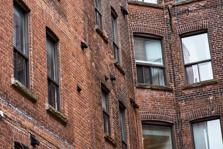 Dark closed square of living houses in old part of Montreal, Canada. close upの写真素材