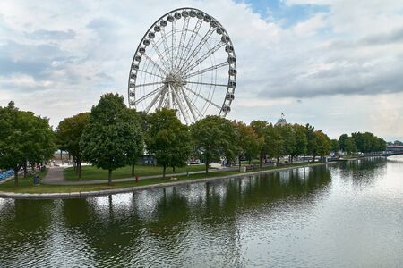MONTREAL, CANADA, SEPTEMBER 3, 2018: La Grande Roue de Montreal the tallest Ferris wheel in Canada allows you to see the city and its surroundings from 60 metres in the air, the equivalent of 20-storey building.のeditorial素材