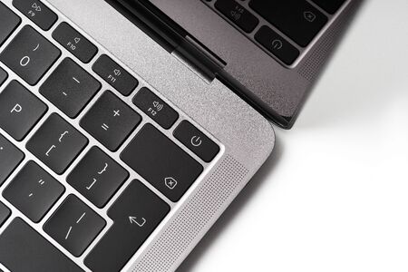 Close up of the laptop keyboard. Black keys on a light background. Silver scratched texture background. The concept of business and information technologies. copy space.の写真素材