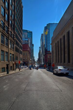 Ottawa, Ontario, Canada September 18, 2018: Street 19-11 Metcalfe St Building, police car with blue sky, Ottawa tour of Canada. Editorial, vertical photo, sunny day empty streets for the weekend.のeditorial素材