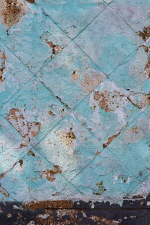 street wall background, aging blue facade of an abandoned fence.の写真素材