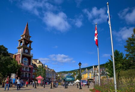 MONT-TREMBLANT, QUEBEC, CANADA, - SEPTEMBER 13, 2018: Mont-Tremblant ski resort, tourists at the main entrance, European view is a year-round ski resortのeditorial素材