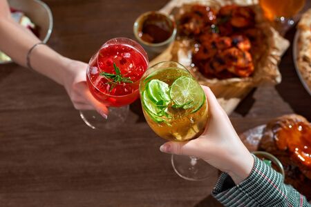 Toast with  coctails in hendsの写真素材