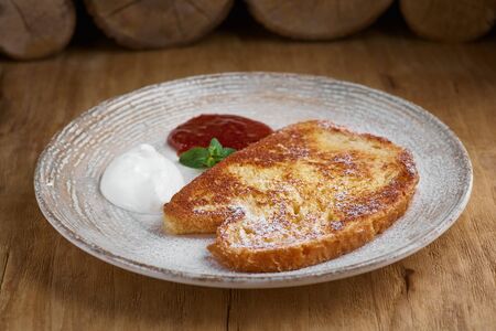 French toasted slices bread and maple syrup. Toasted breads on the plate for breakfast.の写真素材