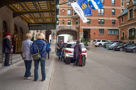 Quebec city, Canada september 23, 2018: tourists at the entrance in Chateau Frontenac is a grand...