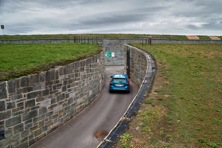 Quebec city, Canada september 23, 2018: Blue car drives into the National Battlefield park in Quebec City's old town. Travel in Canada.のeditorial素材
