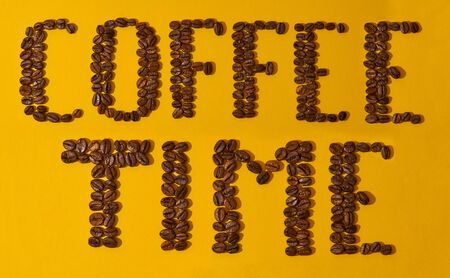 coffee beans on a yellow background, the inscription coffee time