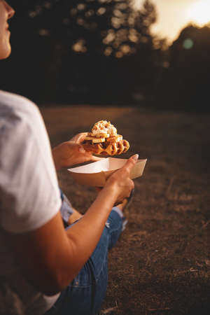 wafer holding in hands, american take-away meal.の写真素材