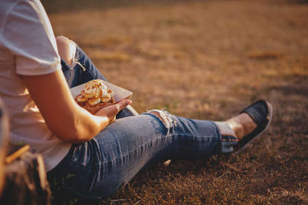 wafer holding in hands, american take-away meal.の写真素材