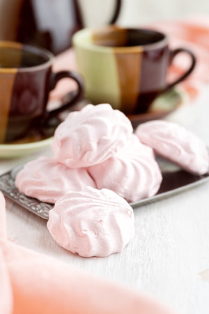Russian Strawberries with cream marshmallows and tea on a bright table. still life, selective focus. verticalの写真素材