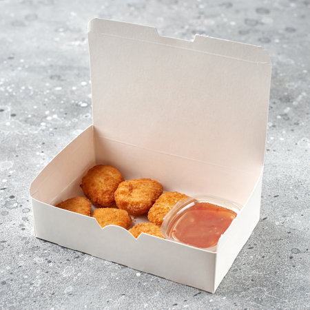 food delivery, takeaway food in paper containers with hot chicken nuggets. menu and logo mockupの写真素材