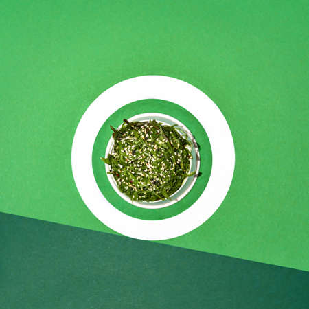 Chuka Seaweed Salad in bowl on green background, copy space. Japanese Cuisine - Chuka Saladの写真素材