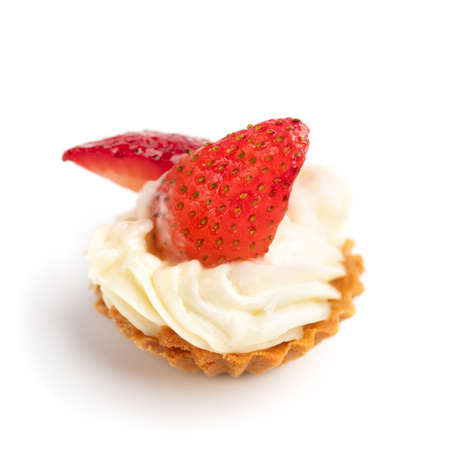 Mini tartlets with cheese and strawberry on a white Cooking concept. Healthy delicious dessertの写真素材