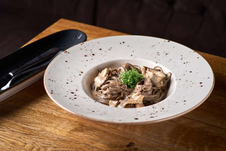 buckwheat spaghetti. Buckwheat noodles with a mix of forest mushrooms.