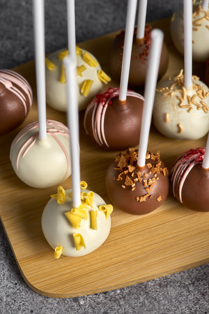 Selection of various bonbons in close up. Fresh desserts.Tasty sweet dessert food for lunch on a...